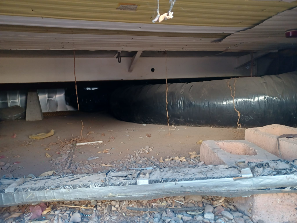 An under-structure crawl space, a common area for pest inspection and control by Zip Zap Termite & Pest Control in Mesa, AZ