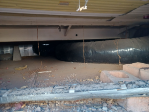 An under-structure crawl space, a common area for pest inspection and control by Zip Zap Termite & Pest Control in Mesa, AZ