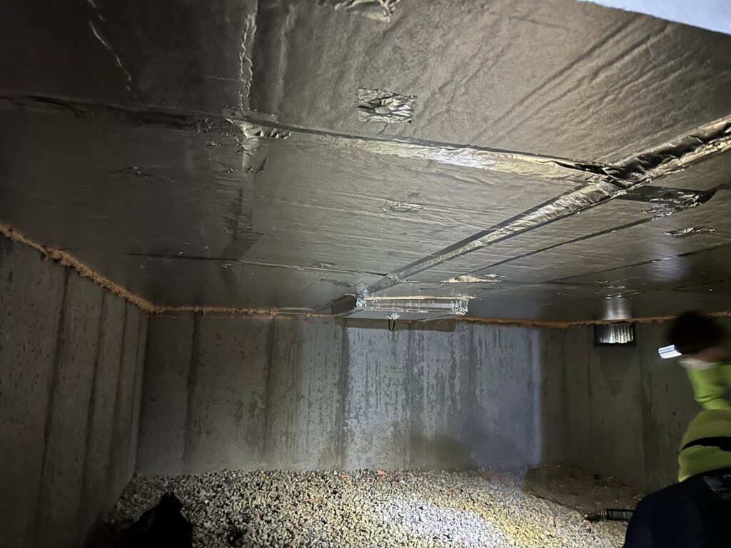 Reflective insulation installed on a crawl space ceiling by HomeWorks Energy in Medford, MA.