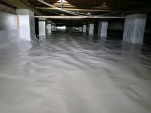 A clean crawl space with a new vapor barrier installed by Global Green Termite & Pest Control LLC in Hampton, VA.