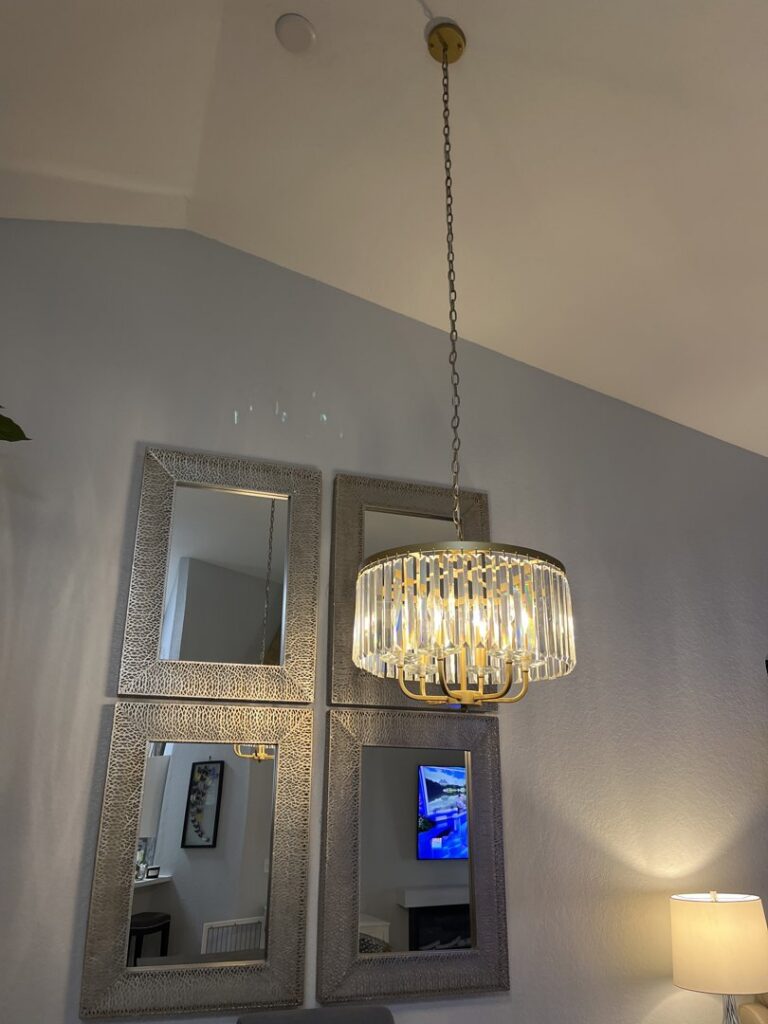 A beautiful crystal chandelier professionally installed on a high ceiling by Small Jobs Electric in Tampa, FL.