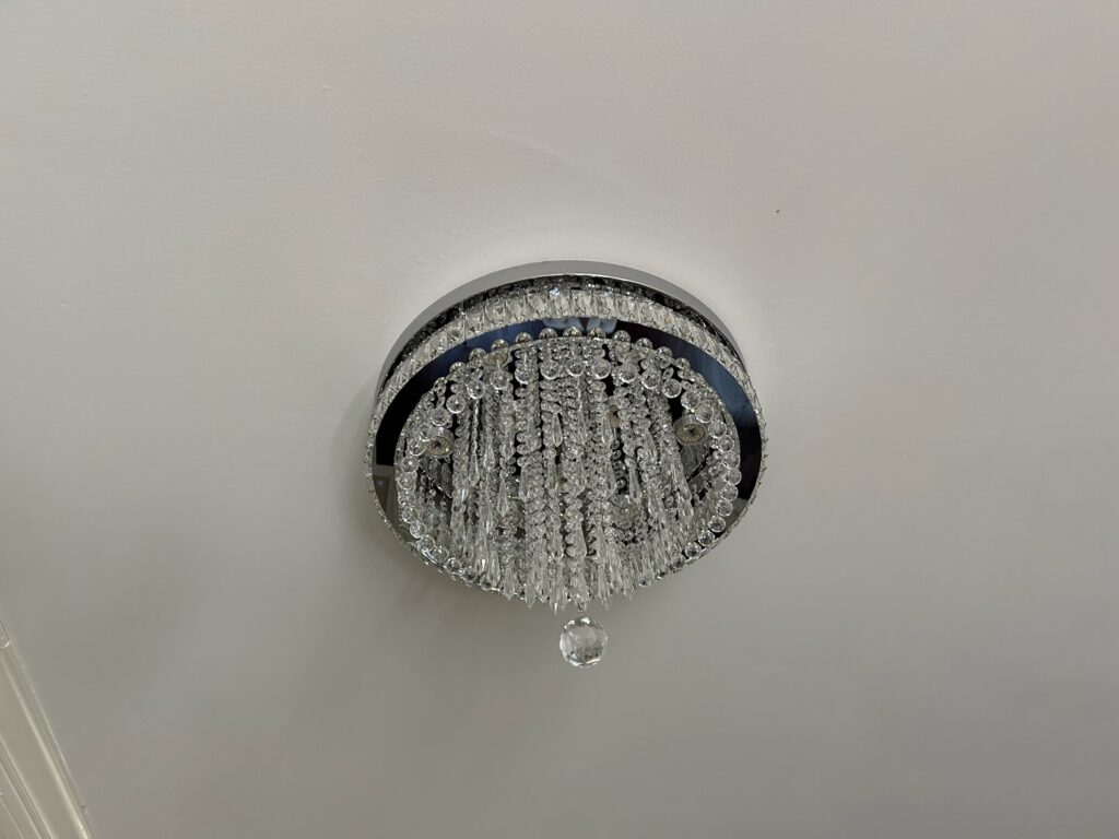 Elegant crystal flush-mount ceiling light installed by Perfection Lighting, Design, and Installations in Atlanta, GA.