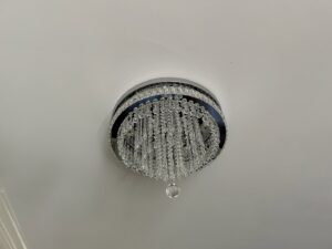 Elegant crystal flush-mount ceiling light installed by Perfection Lighting, Design, and Installations in Atlanta, GA.