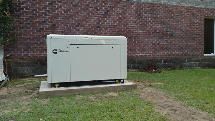 A large Cummins standby generator unit professionally installed by Stone Electrical Construction in Florence, SC.