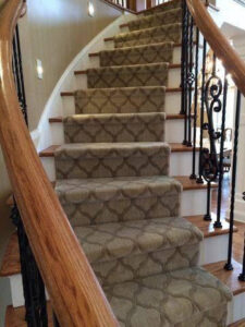 A beautifully installed patterned carpet on a curved staircase by Carpet King and Flooring in Myrtle Beach, SC.