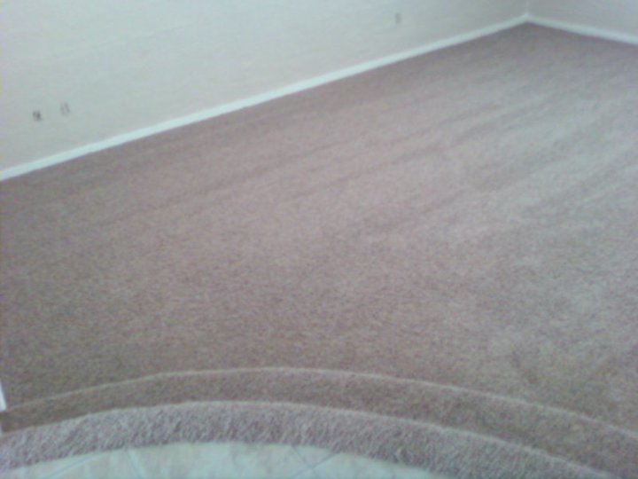 Close-up of a curved carpeted step in a room, installed by Magick Flooring Installs in Phoenix, AZ