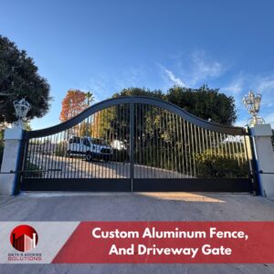A custom aluminum fence and driveway gate installed by Gates Access Solutions in San Diego, CA