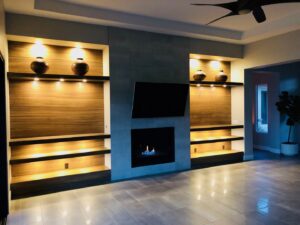 Custom built-in shelves with integrated lighting and TV installation completed by Eco Electric in Las Vegas, NV.