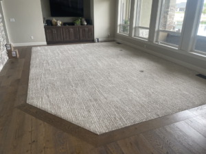 A custom-shaped carpet installed in a living room by Alpine Floor Covering in Nampa, ID.