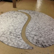 A custom carpet installation with a unique wavy design laid out by J & M Flooring Supply in Lakewood, NJ.