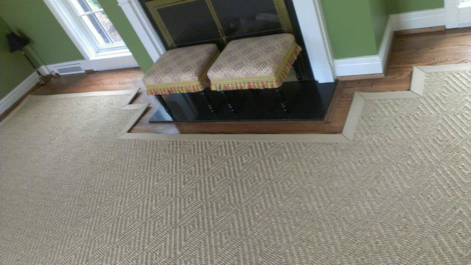 Custom-cut woven carpet expertly installed around a fireplace by Carpet Art of America in O'Fallon, MO.