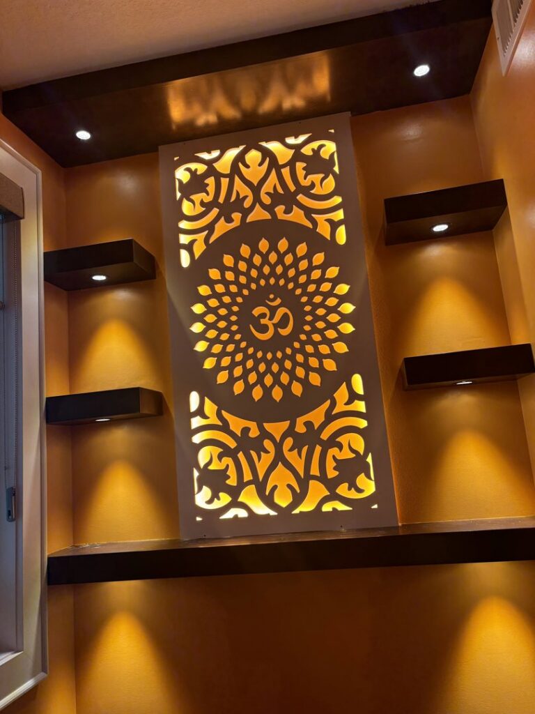 Custom decorative wall panel with backlighting and recessed lights installed by Amped Electric in Virginia Beach, VA.