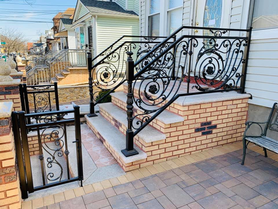 Custom ornamental metal railing and a small gate for steps by Elite Ornamental Fence LLC in Paterson, NJ.