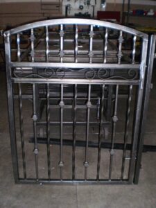 A custom ornate metal gate design, demonstrating welding expertise by Done Wright Fencing and Welding in Denver, CO.