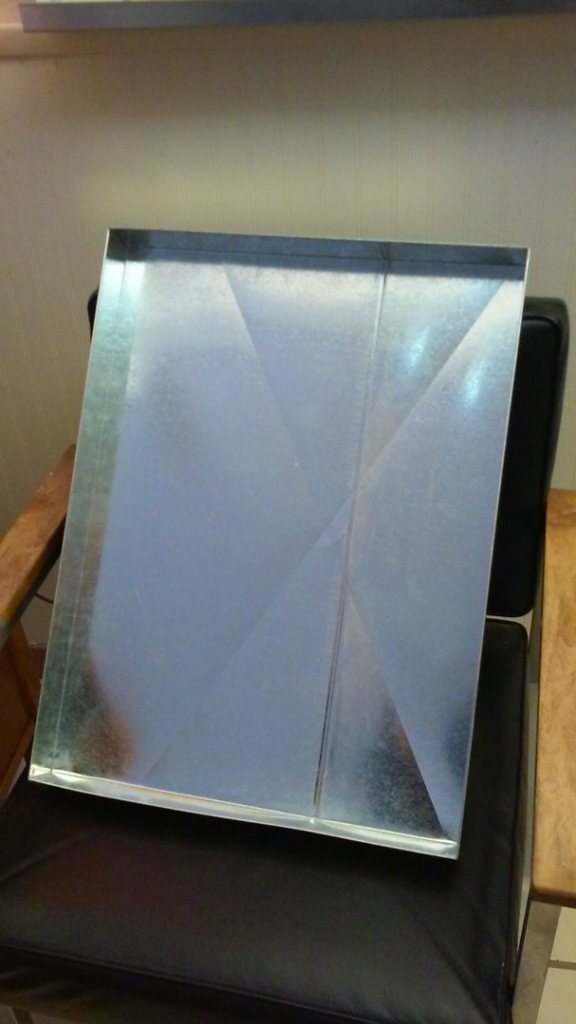 A piece of custom fabricated sheet metal, used for HVAC systems by Avallone Mechanical Company in Las Cruces, NM.