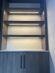 Custom shelves with modern LED lighting design installed by Nech Electric Services Inc. in Chicago, IL.
