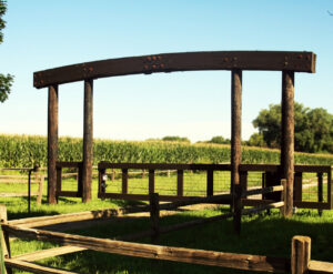 A custom wood fence entrance structure installed by American Fence Company of Columbus in Grand Island, NE.