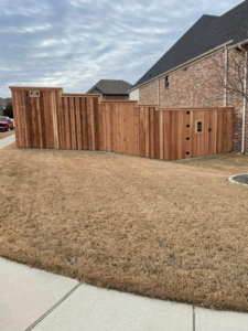 Custom wood fence with an integrated gate installed by Plano Fence and Arbor Pro in Plano, TX.