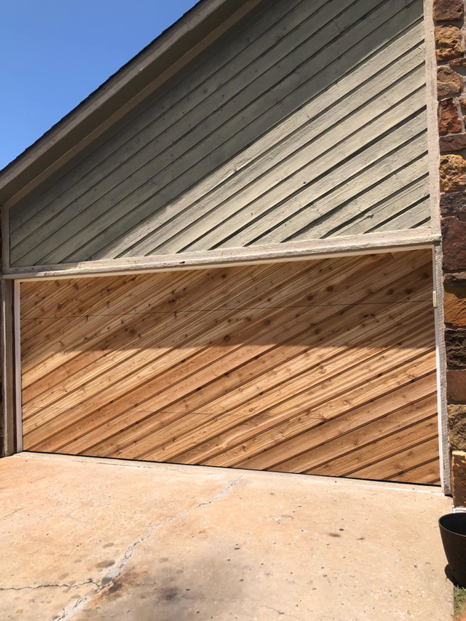 A custom wood garage door with diagonal panels installed by L & S Overhead Door in Tulsa, OK.