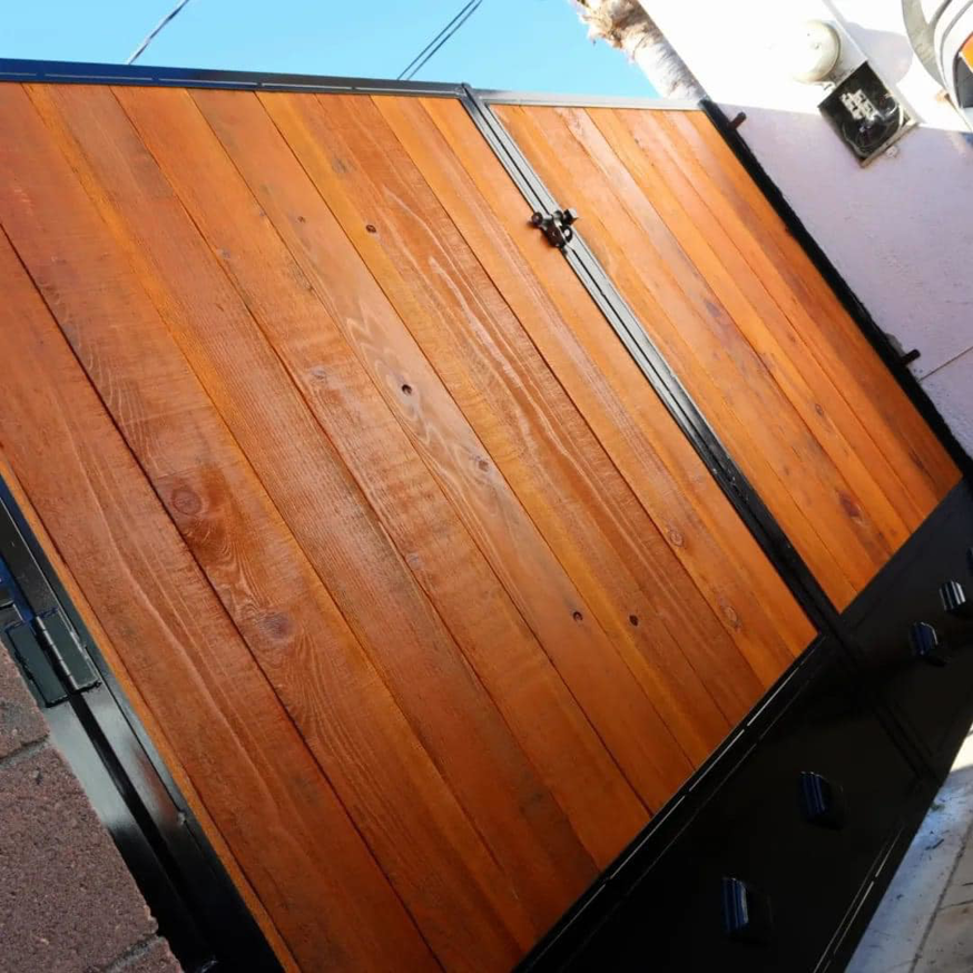 A custom-built wood and metal gate, expertly installed by Portugal's IronWorks in Los Angeles, CA.