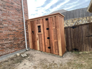 Custom wood shed and privacy fence installed by Plano Fence and Arbor Pro in Plano, TX.
