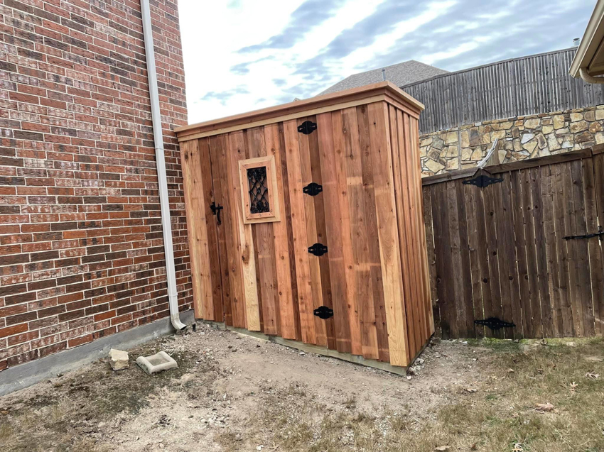 Custom wood shed and privacy fence installed by Plano Fence and Arbor Pro in Plano, TX.