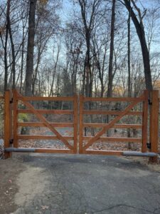 A custom wooden double entry gate installed by RP Fencing & Gates in Brewster, NY