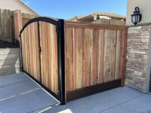 A custom wooden gate with a sturdy metal frame installed at a residential property by Horizon Fence & Custom Gates, Inc. in Orangevale, CA.