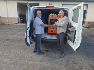 A customer shaking hands after receiving a new truck mount carpet cleaning system from El Diablo Truck Mounts in Rapid City, SD.