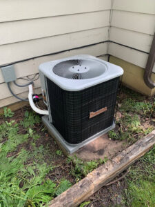 A newly installed Daikin outdoor air conditioning unit next to a residential home by Matt Moeller Heating and Cooling Llc in Stewartville, MN