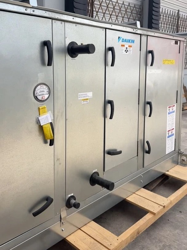 A large Daikin commercial HVAC unit, likely an air handler, at SURPLUS AC INC. in Doral, FL