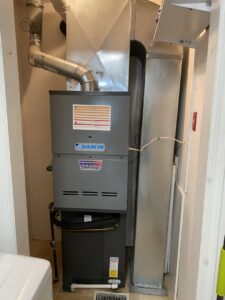 A Daikin furnace and air handler unit with ductwork installed by Riccardi Heating and Air in Toms River, NJ.