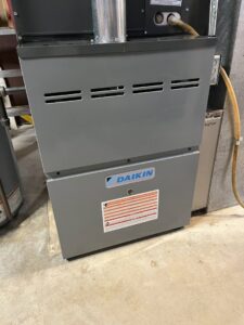 A new Daikin furnace unit installed indoors by Swiss Air Heating & Cooling, serving O'Fallon, MO, for reliable heating.