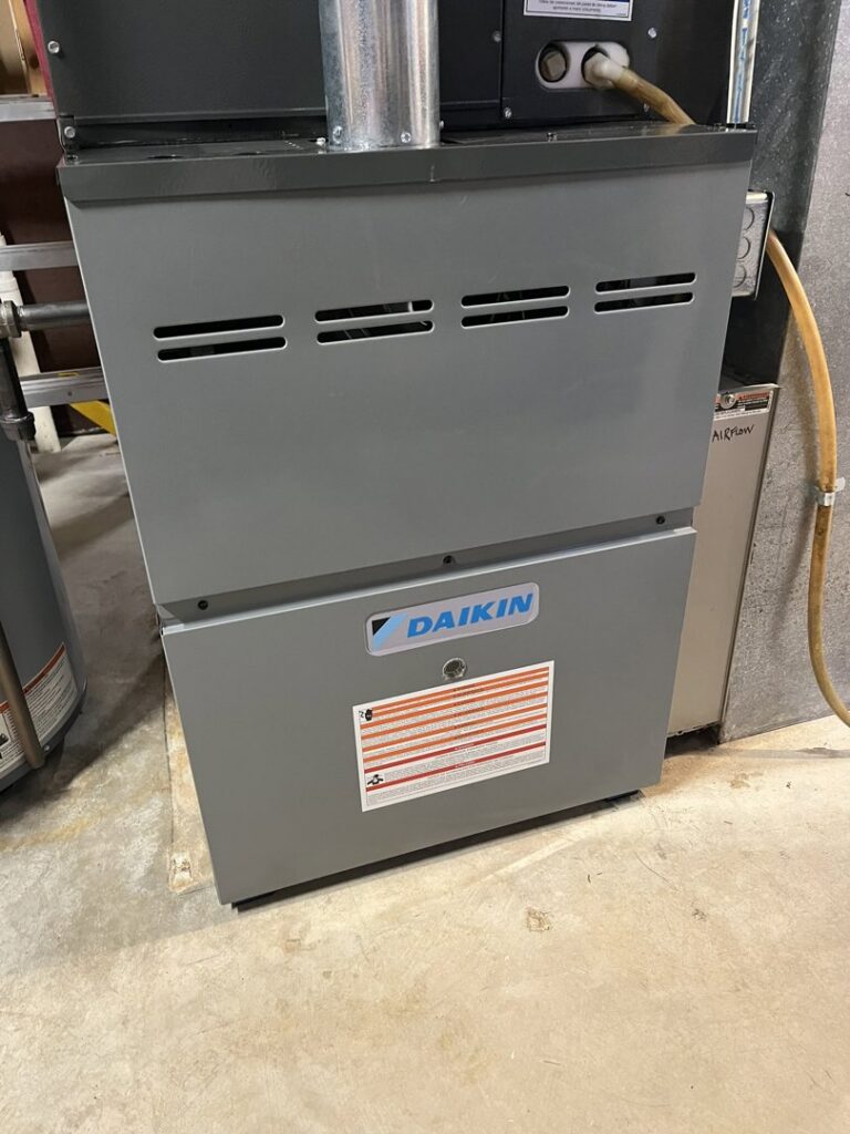 A new Daikin furnace unit installed indoors by Swiss Air Heating & Cooling, serving O'Fallon, MO, for reliable heating.