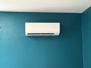 A Daikin indoor mini-split unit installed on a vibrant blue wall by DiMartino's 5 Star Heating & Air Conditioning LLC in Salem, OR.