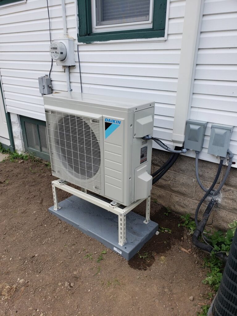 An outdoor Daikin mini-split condenser unit professionally installed by 9-1-1 Heating & Air, LLC for efficient cooling in Milwaukee, WI.