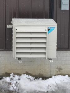 A Daikin mini-split outdoor condenser unit installed by All Systems LLC, providing heating and cooling in Fremont, NE