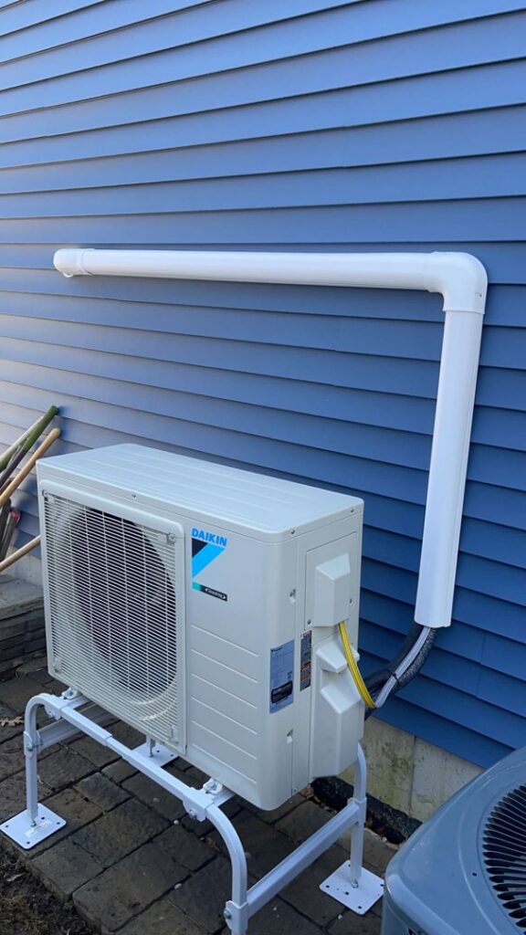 A Daikin mini-split heat pump outdoor unit installed on a stand by Ferreira Mechanical, LLC in Fall River, MA