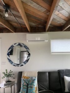 A Daikin mini-split indoor unit installed on a wall in a living room by Heatwave Heating & Air LLC in Federal Way, WA.