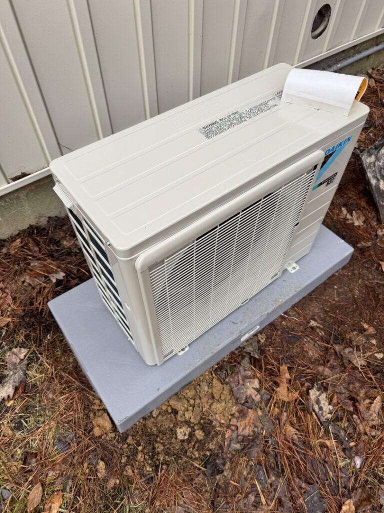 A new Daikin mini-split outdoor condenser unit installed by Southern Climate Pros, offering efficient cooling in Jasper, AL.
