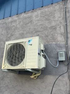 An outdoor Daikin mini-split condenser unit installed on a wall by Best Plumbing Heating & Cooling Contractors in Albany, NY.