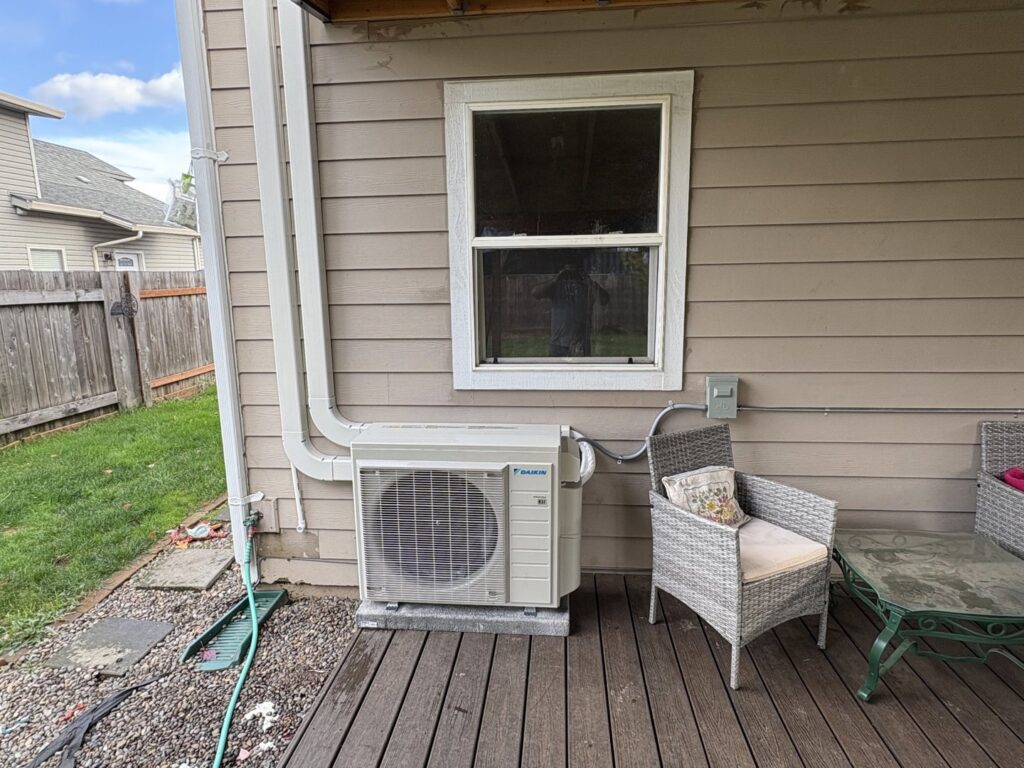 A Daikin mini-split outdoor unit installed on a residential deck by DiMartino's 5 Star Heating & Air Conditioning LLC in Salem, OR.