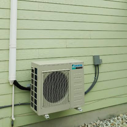 An outdoor Daikin AC unit installed on the side of a house by Fields Cooling Heating & Refrigeration in Foley, AL.