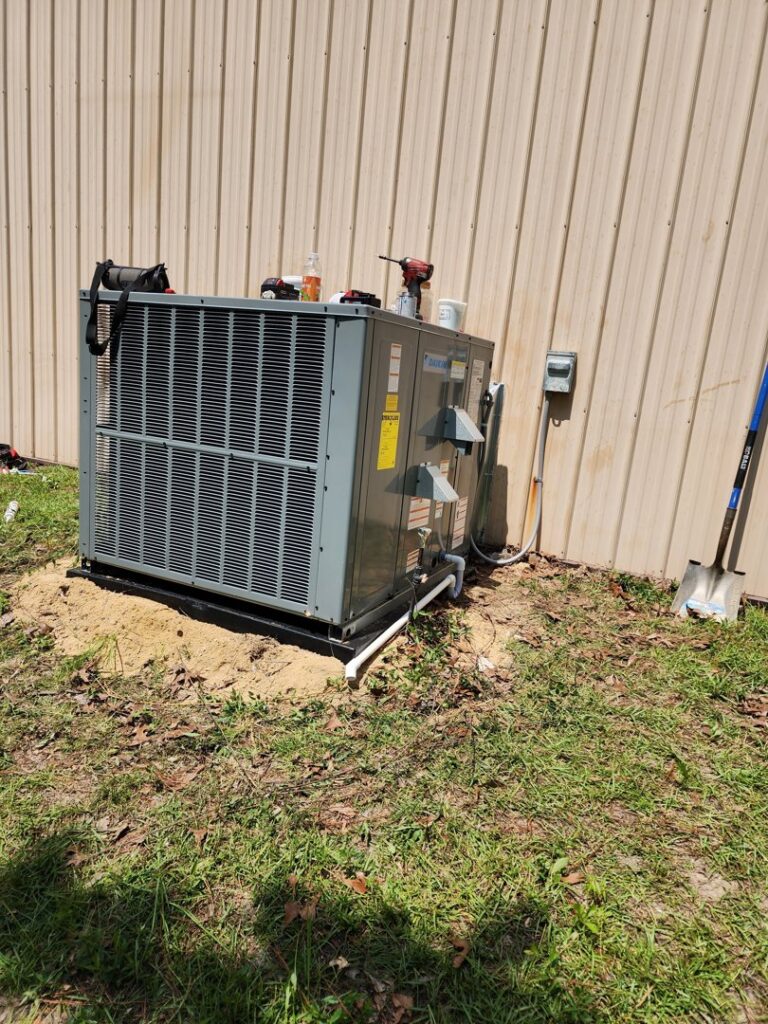 A newly installed Daikin outdoor AC unit next to a building by Krantz Kooling & Heating in West Columbia, SC