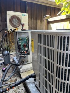 A Daikin outdoor AC unit undergoing service or repair with internal components exposed by McGuffee's Air Conditioning and Heating in Gulfport, MS