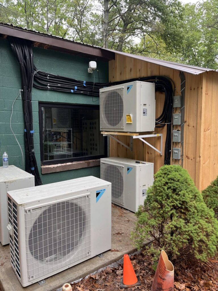 Multiple Daikin outdoor HVAC condenser units installed by Rowan Heating and Air Conditioning, Inc. in Highland, MD