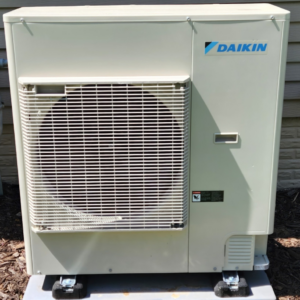 A Daikin outdoor HVAC unit installed by Dixon's Heating & Air Conditioning, Inc. in Athens, IL
