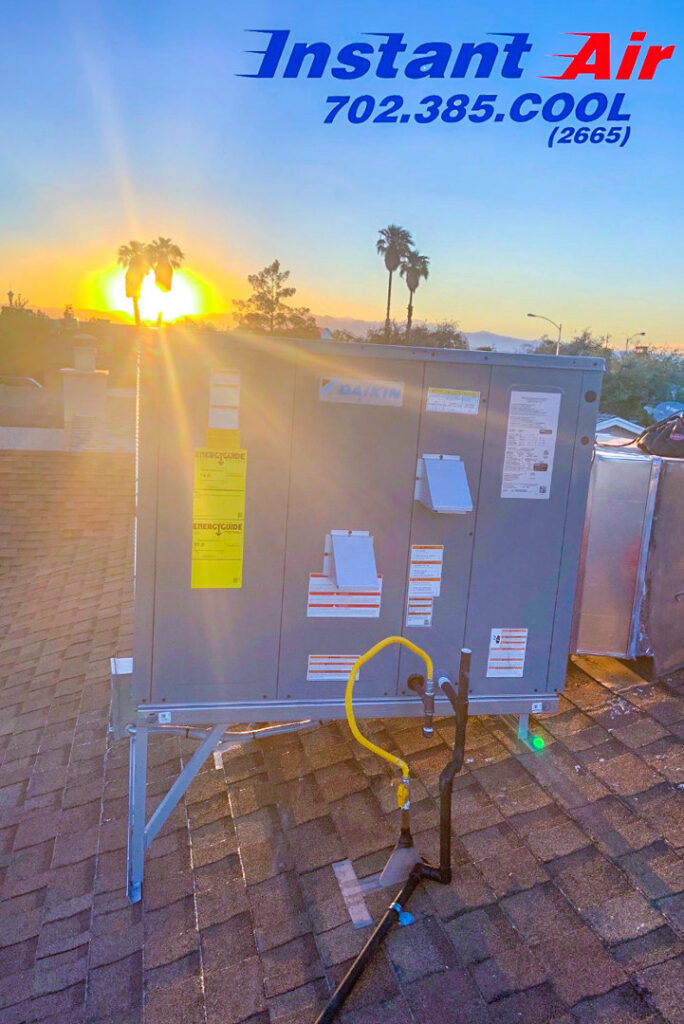 A Daikin rooftop HVAC unit installed by Instant Air, seen at sunset in Las Vegas, NV.
