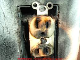 A damaged and burnt electrical outlet requiring repair from Your Electrician in Yakima, WA.