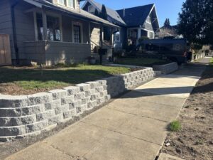 A damaged chain link fence section needing repair, a service offered by Fence Repair Master in Vancouver, WA.